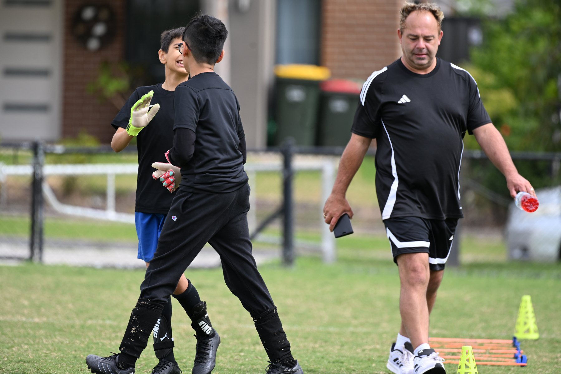 Keeper and coach post-drill